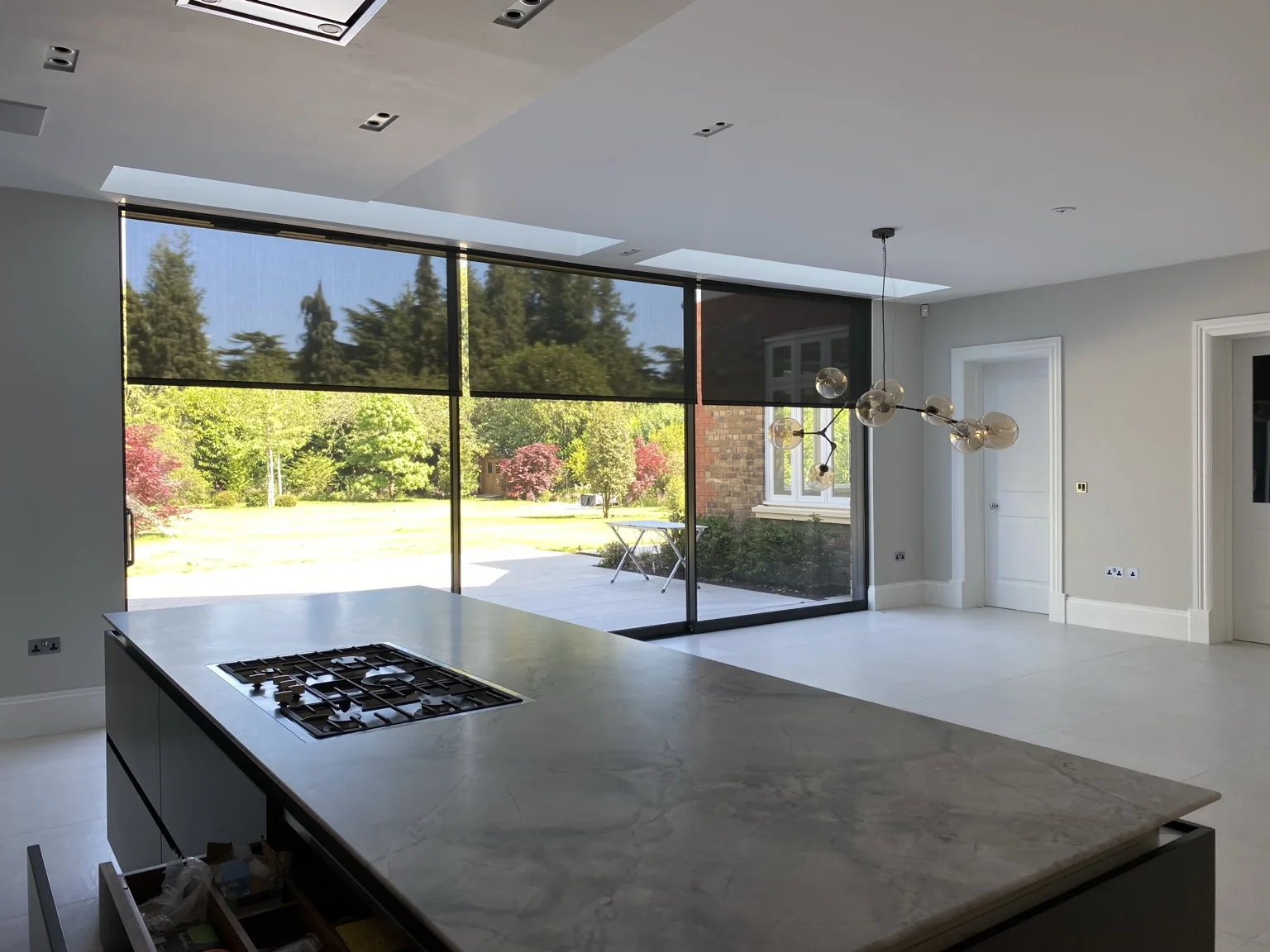 Large glazed kitchen with integrated external-view solar screens