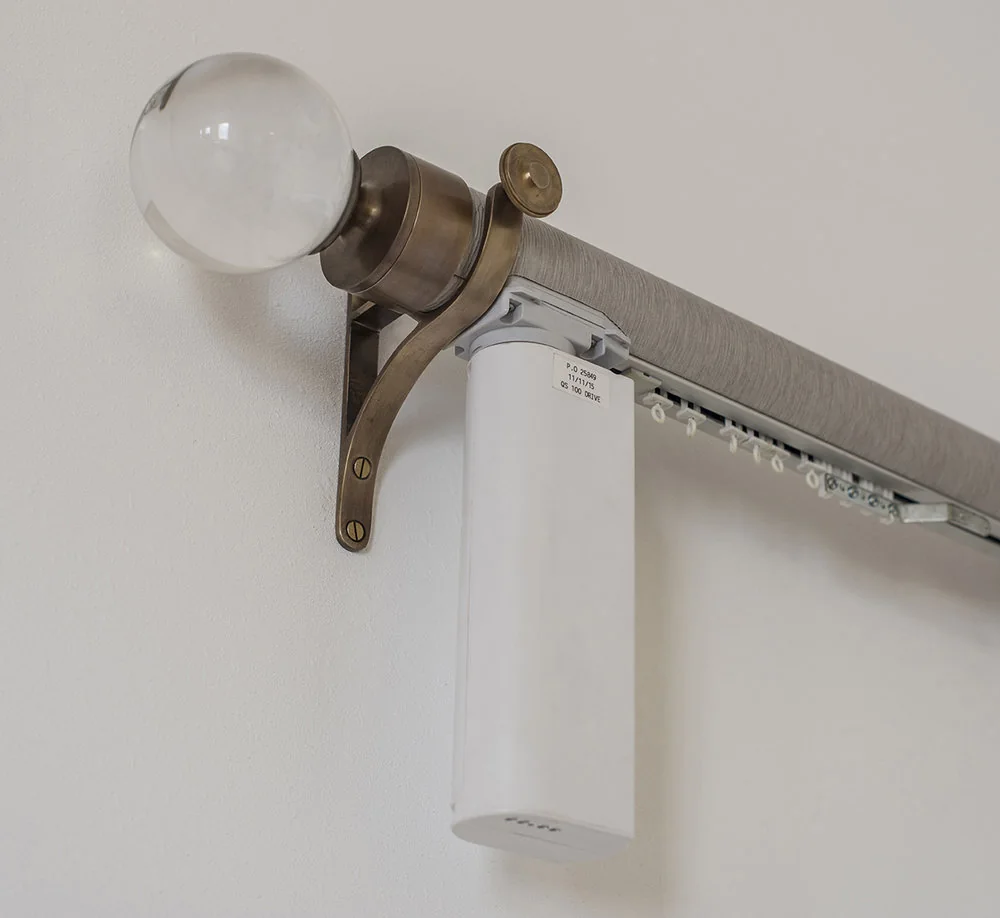 Close detail of a concealed motorised curtain track mechanism